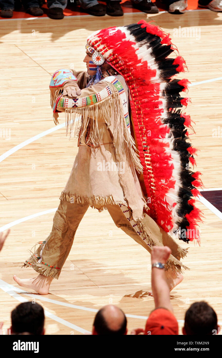 University of Illinois mascot Chief Illiniwek, portrayed by Dan Maloney walks off the floor after performing at halftime of the Illinois' basketball game against the University of Michigan at the University of Illinois Assembly Hall in Champaign, Il., February 21, 2007. Chief Illiniwek was retired by the University after the NCAA imposed sanctions for having a mascot portraying offensive use of American Indian imagery. (UPI Photo/Mark Cowan) Stock Photo