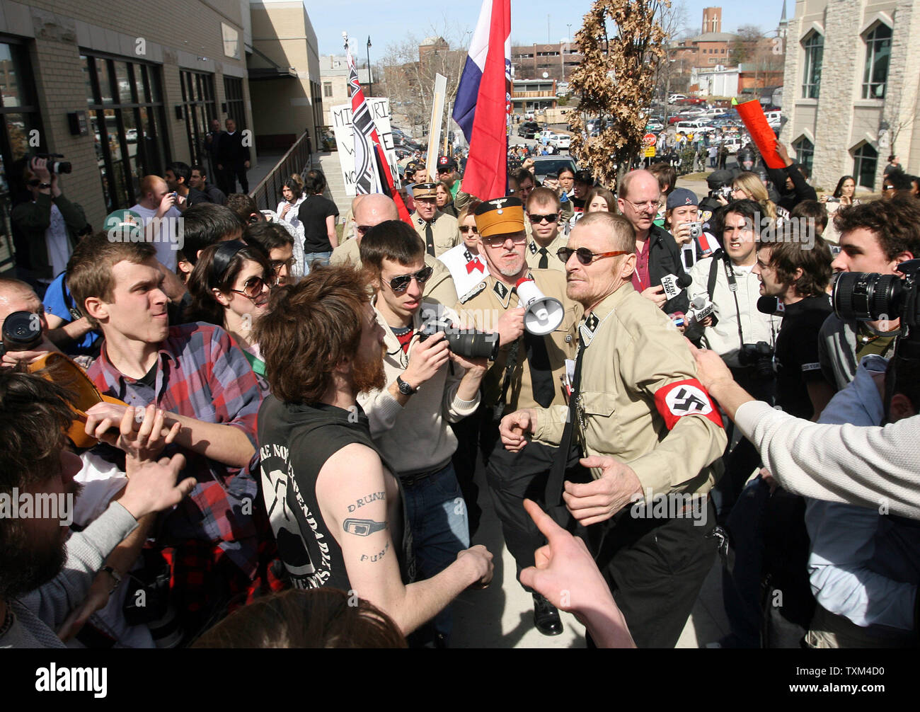 Protesters exchange shoves with members of the National Socialist Movement during their march on the campus of the University of Missouri in Columbia, Missouri on March 10, 2007. About 20 marchers were met by throngs of students that cursed them and tossed eggs into their march. (UPI Photo/Bill Greenblatt) Stock Photo