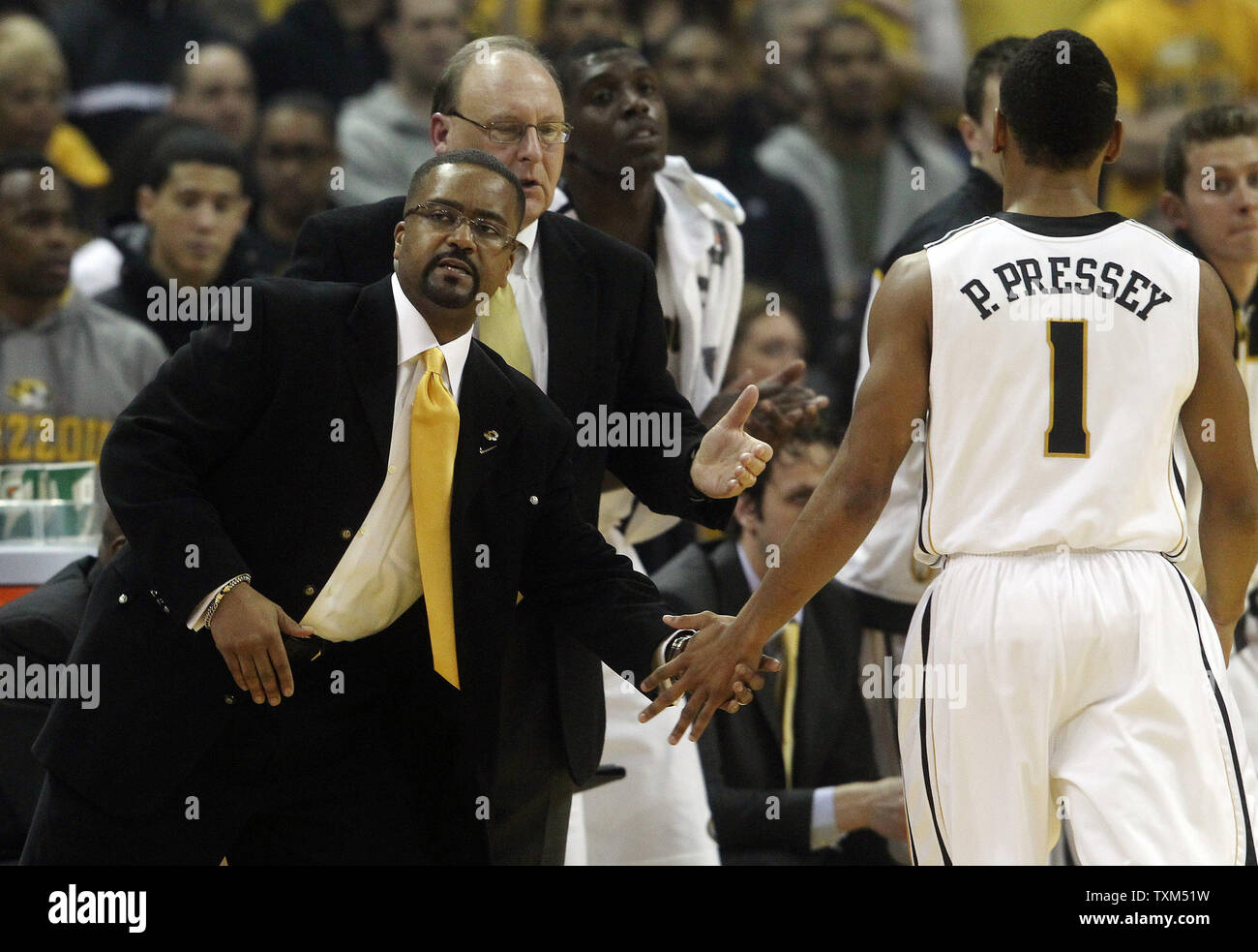 Missouri Tigers head basketball coach Frank Haith shakes the hand of Phil  Pressey as he takes a break in the first half against the Kansas Jayhawks  at the Mizzou Arena in Columbia,