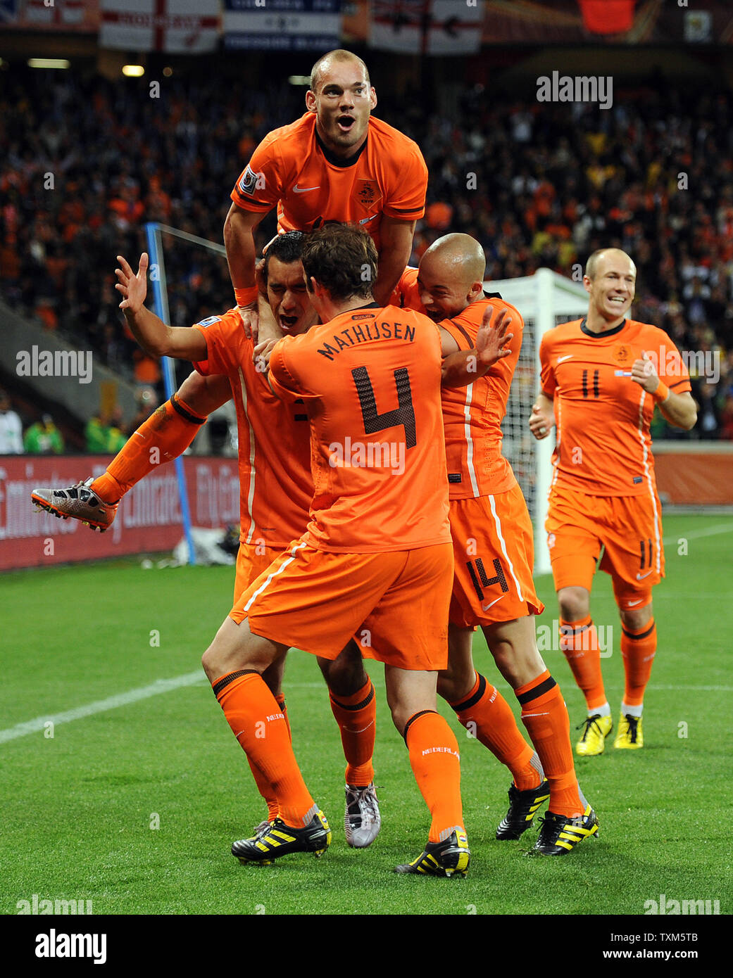 Giovanni Van Bronckhorst of Holland is mobbed by his team-mates after scoring the opening goal during the FIFA World Cup Semi Final match at the Green Point Stadium in Cape Town, South Africa on July 6, 2010. UPI/Chris Brunskill Stock Photo