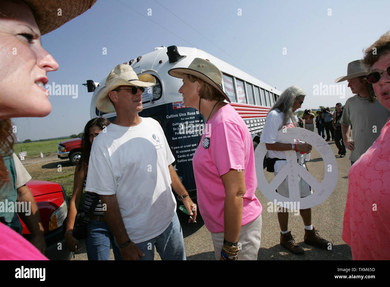 Peace Activist Cindy Sheehan talks with a supporter, Buddy Spell, from  Covington, Louisiana before boarding a bus near President Bush's Ranch in  Crawford that will begin a cross country bus tour which