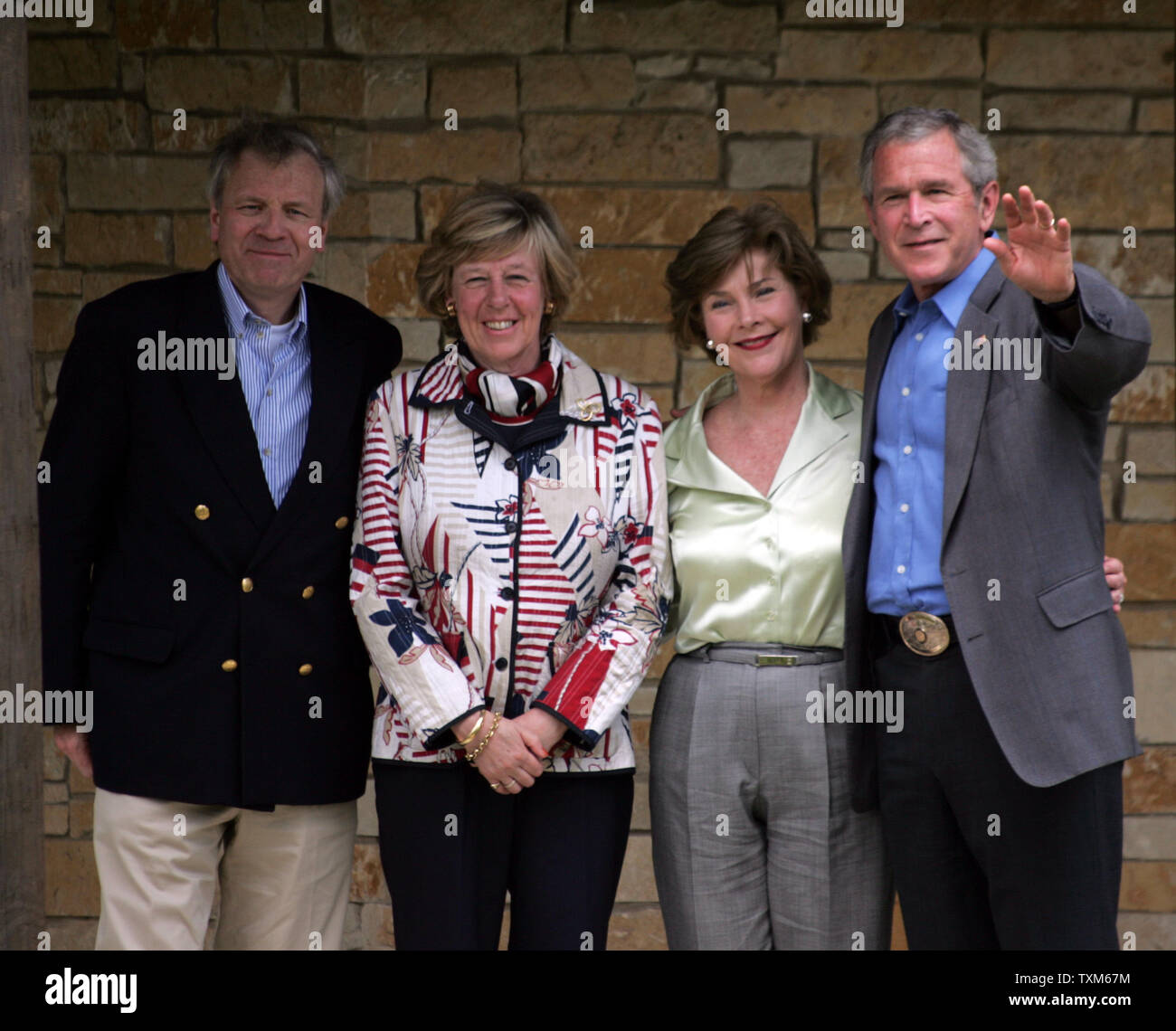 U.S. President George W. Bush (R), NATO Secretary General Jaap de Hoop Scheffer (L), First Lady Laura Bush (2nd-L) and Scheffer's wife Jaap de Hoop Scheffer pose for a photo-op following a meeting between Scheffer and Bush, at Bush's ranch in Crawford, Texas, May 21, 2007. (UPI Photo/Ron Russek II) Stock Photo