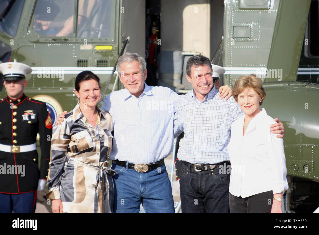 Prime Minister of Denmark Anders Fogh Rasmussen (2nd R) and his wife Anne-Mette Rasmussen (L) pose for photos with U.S. President George W. Bush (2nd L) and First Lady Laura Bush at their ranch in Crawford, Texas, February 29, 2008. President Bush will host the Prime Minister over night in Crawford. (UPI Photo/Ron Russek II) Stock Photo