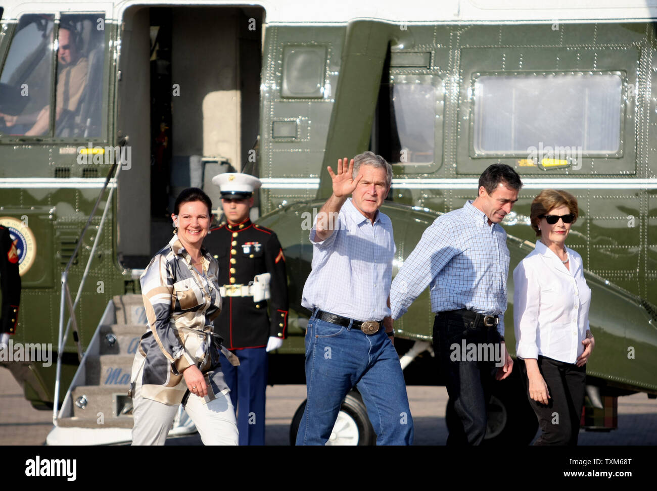 Prime Minister of Denmark Anders Fogh Rasmussen (2nd R) and his wife Anne-Mette Rasmussen (L) walk with U.S. President George W. Bush (2nd L) and First Lady Laura Bush at their ranch in Crawford, Texas, February 29, 2008. President Bush will host the Prime Minister over night in Crawford. (UPI Photo/Ron Russek II) Stock Photo