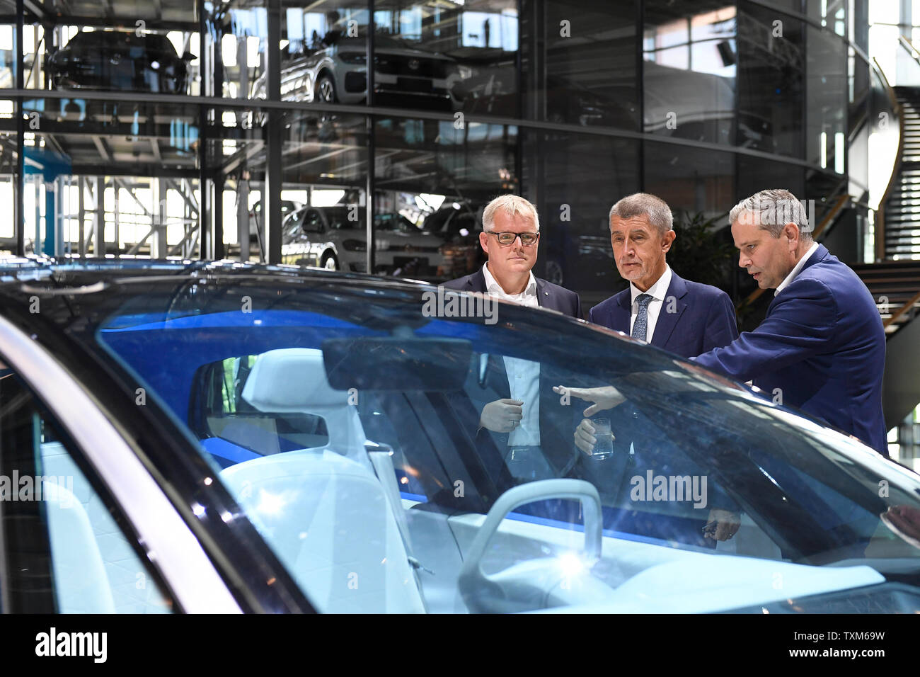 Czech Prime Minister Andrej Babis, center, visits a Volkswagen plant in Dresden, Germany, on June 25, 2019. On the photo is seen a Showcard ID concept, and company representative Kai Siedlatzek, left, and Director of the plant Lars Dittert, right. (CTK Photo/Ondrej Deml) Stock Photo