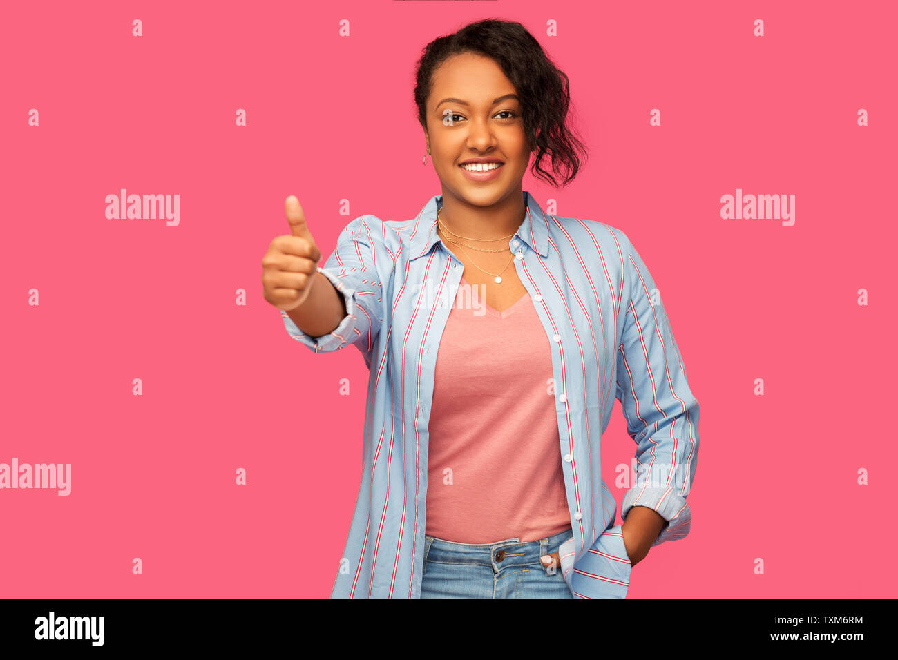 happy african american woman showing thumbs up Stock Photo - Alamy