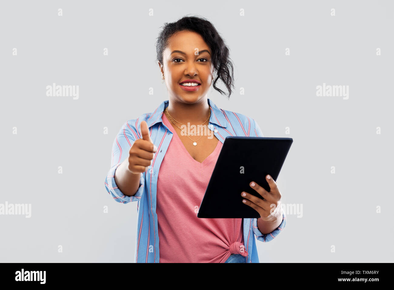 happy african american woman showing thumbs up Stock Photo - Alamy