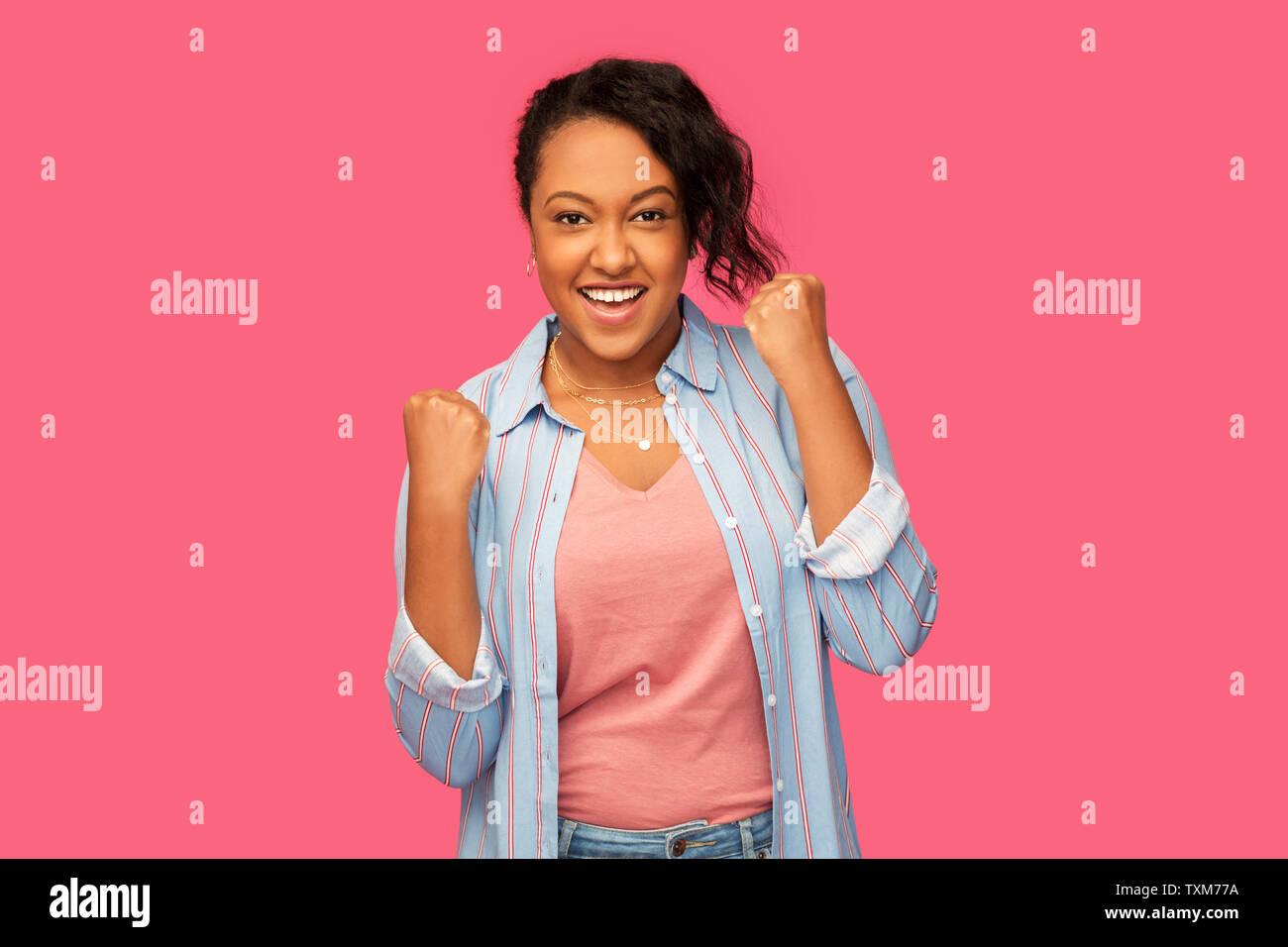 happy african american woman celebrating success Stock Photo - Alamy