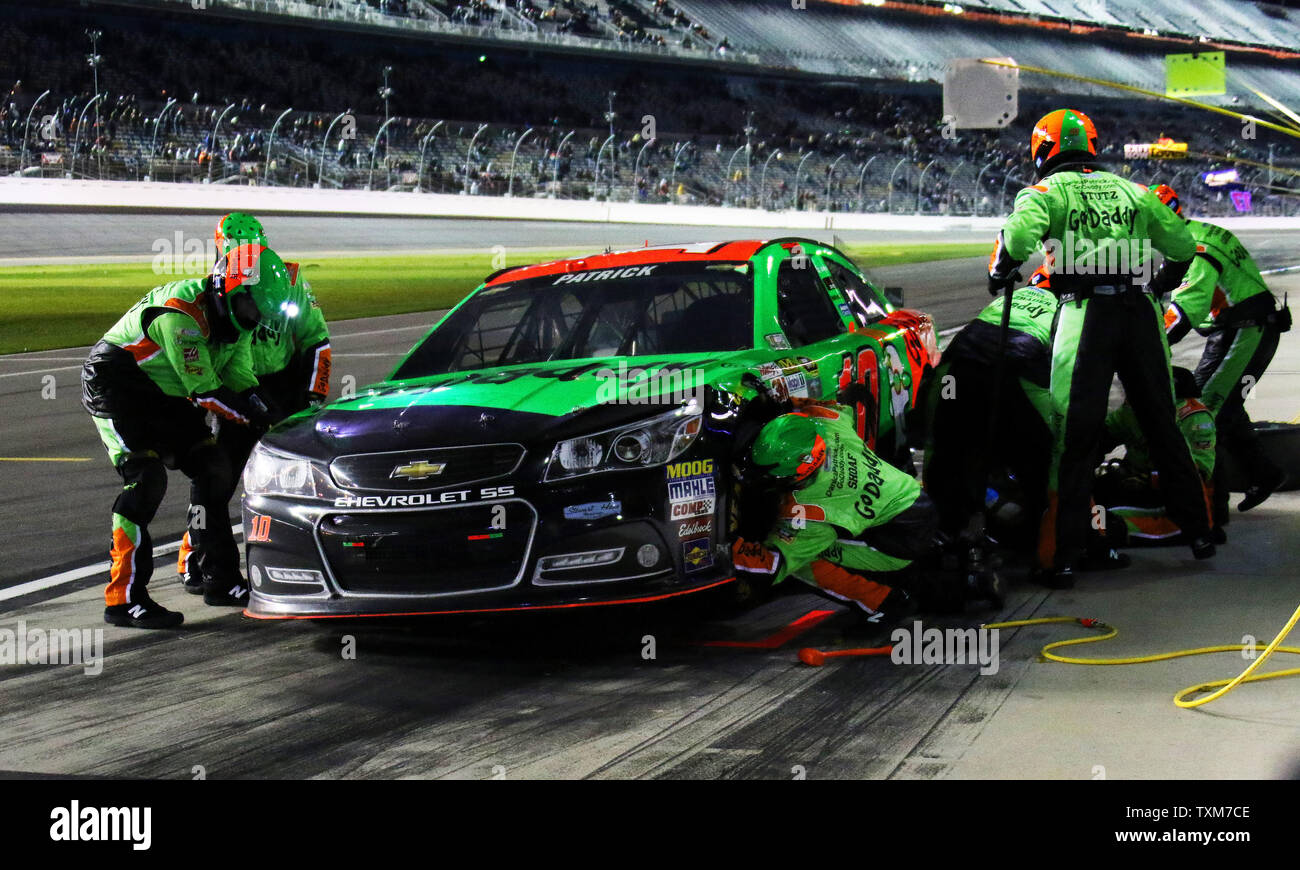 Crew members scramble to repair the car of  Danica Patrick after a late race incident at Daytona International Speedway on February 19, 2015 in Daytona Beach, Florida.    Photo by Ed Locke/UPI Stock Photo