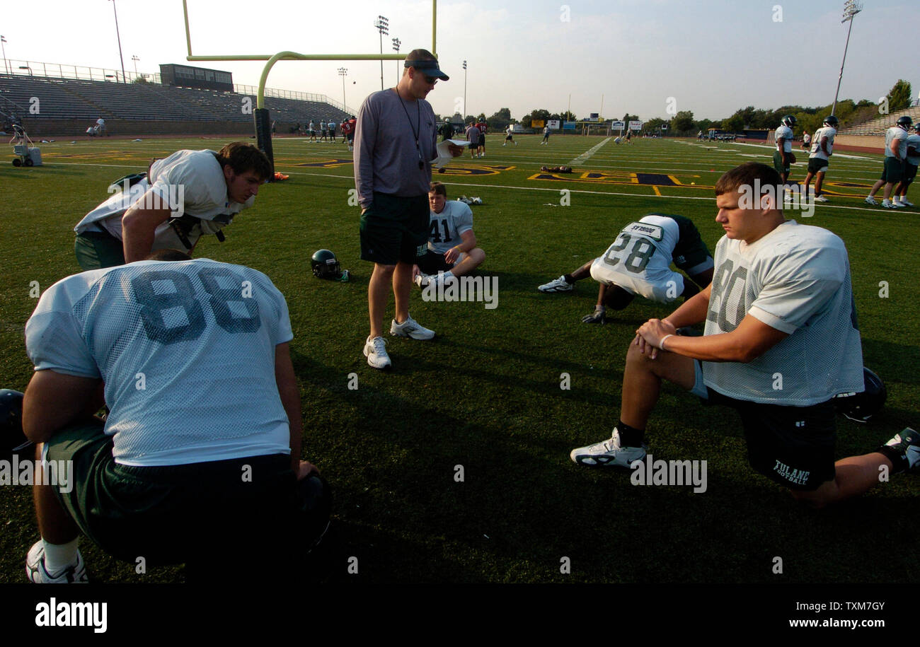 Members of the Tulane University football team conduct morning practice