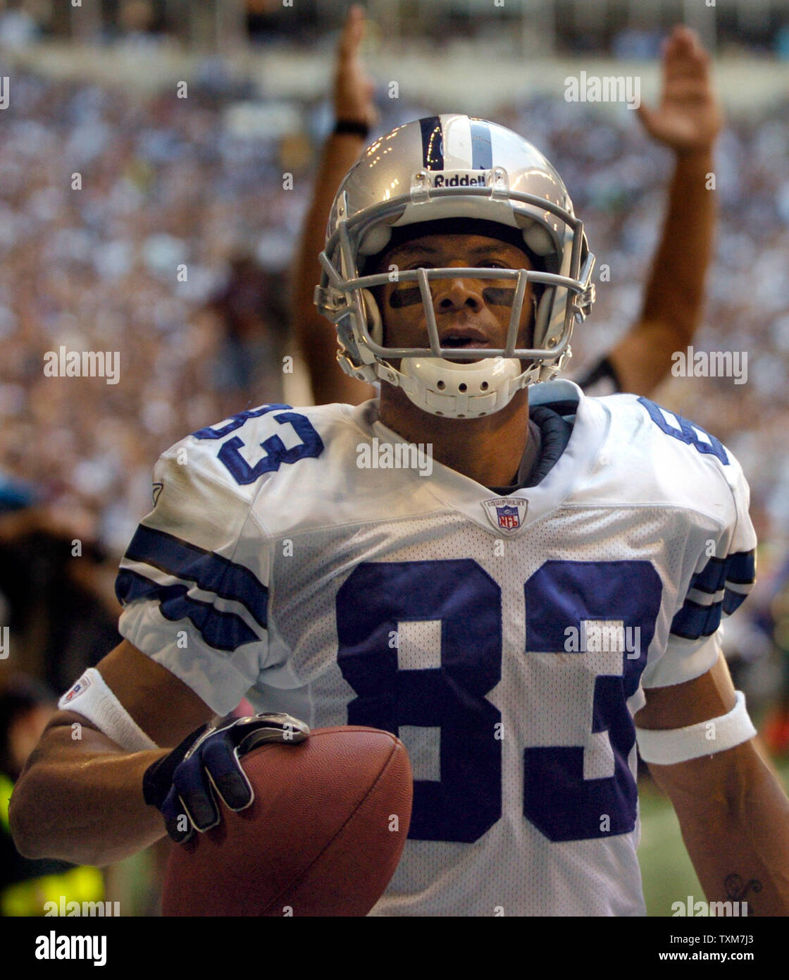 Wide receiver Terry Glenn, of the Dallas Cowboys, returns a pass down  field, in the 3rd quarter, as the Dallas Cowboys face the New England  Patriots, at Gillette Stadium, in Foxboro, Mass