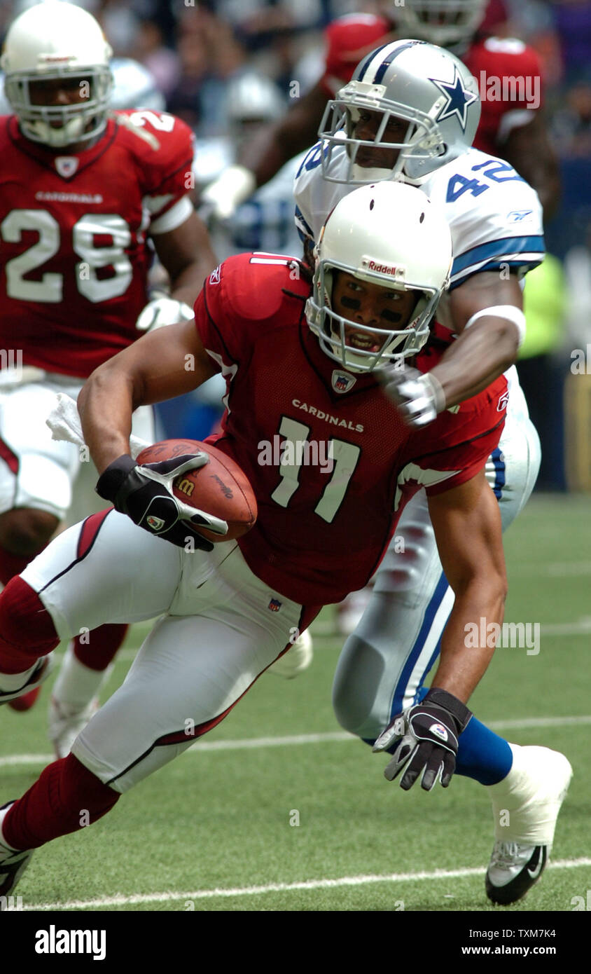Arizona's Larry Fitzgerald gets way from Dallas' Anthony Henrie during the Cowboys-Cardinals game October 30, 2005 at Texas Stadium. The Cowboys defeated the Cardinals 34-13.  (UPI Photo/Ian Halperin) Stock Photo