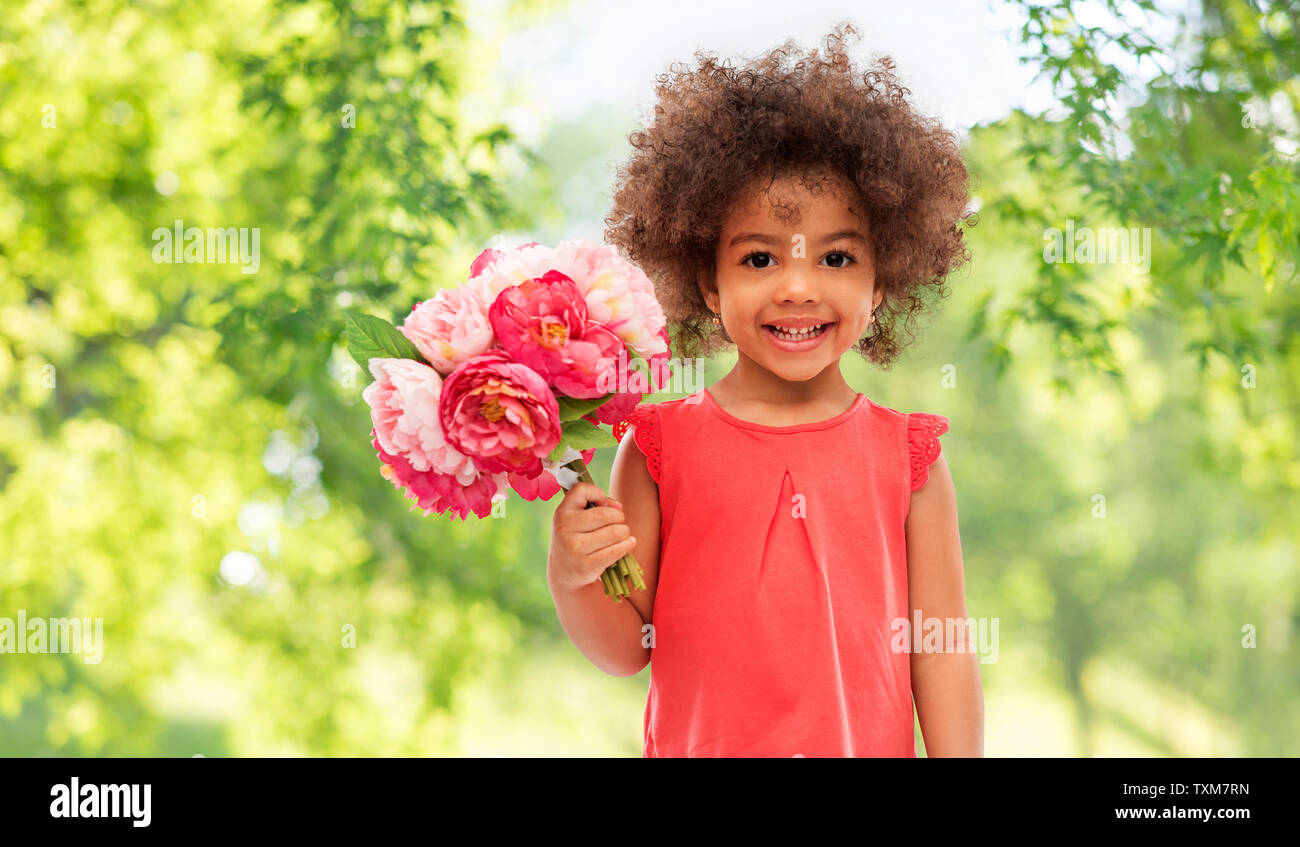 happy little african american girl with flowers Stock Photo - Alamy