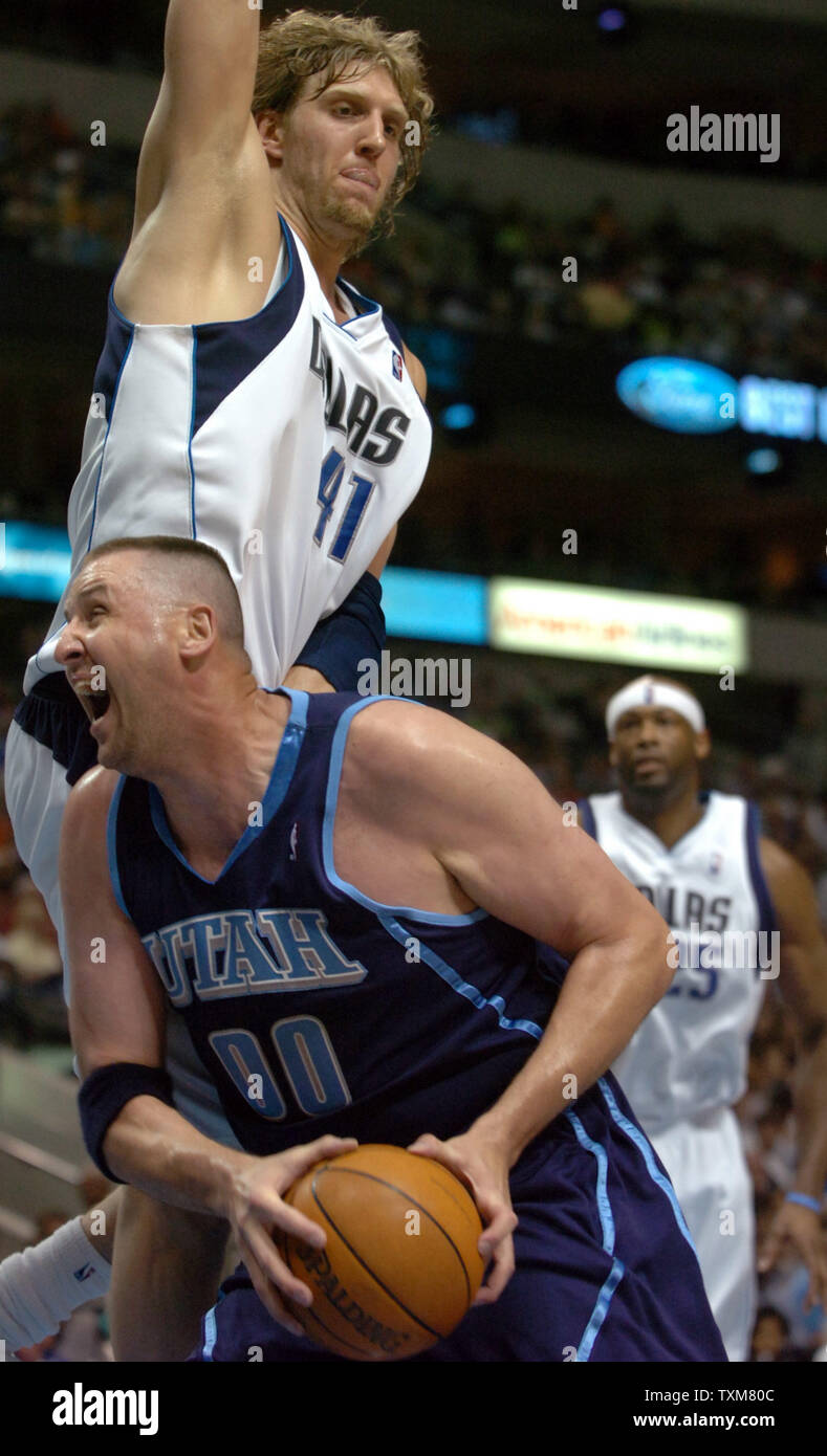 Utah's Greg Ostertag gets fouled by Dallas' Dirk Nowitzki in the Dallas Mavericks-Utah Jazz game April 16, 2006 at the American Airlines Center in Dallas, Texas.   (UPI Photo/Ian Halperin) Stock Photo