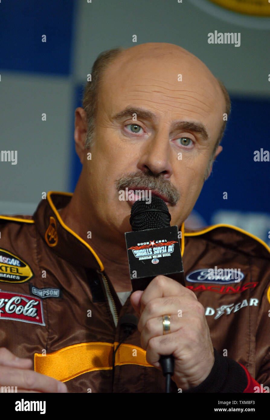Dr. Phil McGraw talks to the media about the U.S. Marine Corps Reserves Toys for Tots program prior to the NASCAR Dickies 500 at Texas Motor Speedway in Ft. Worth, TX on November 5, 2006.  The McGraw teamed up with NASCAR to help raise awareness of the program.    (UPI Photo/Ian Halperin) Stock Photo