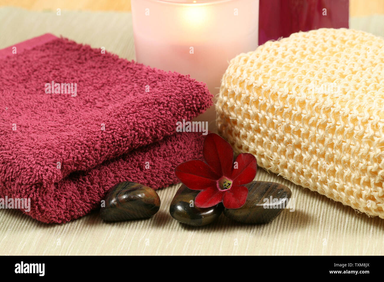 Luxury spa therapy in maroon color. Relaxation moments Stock Photo