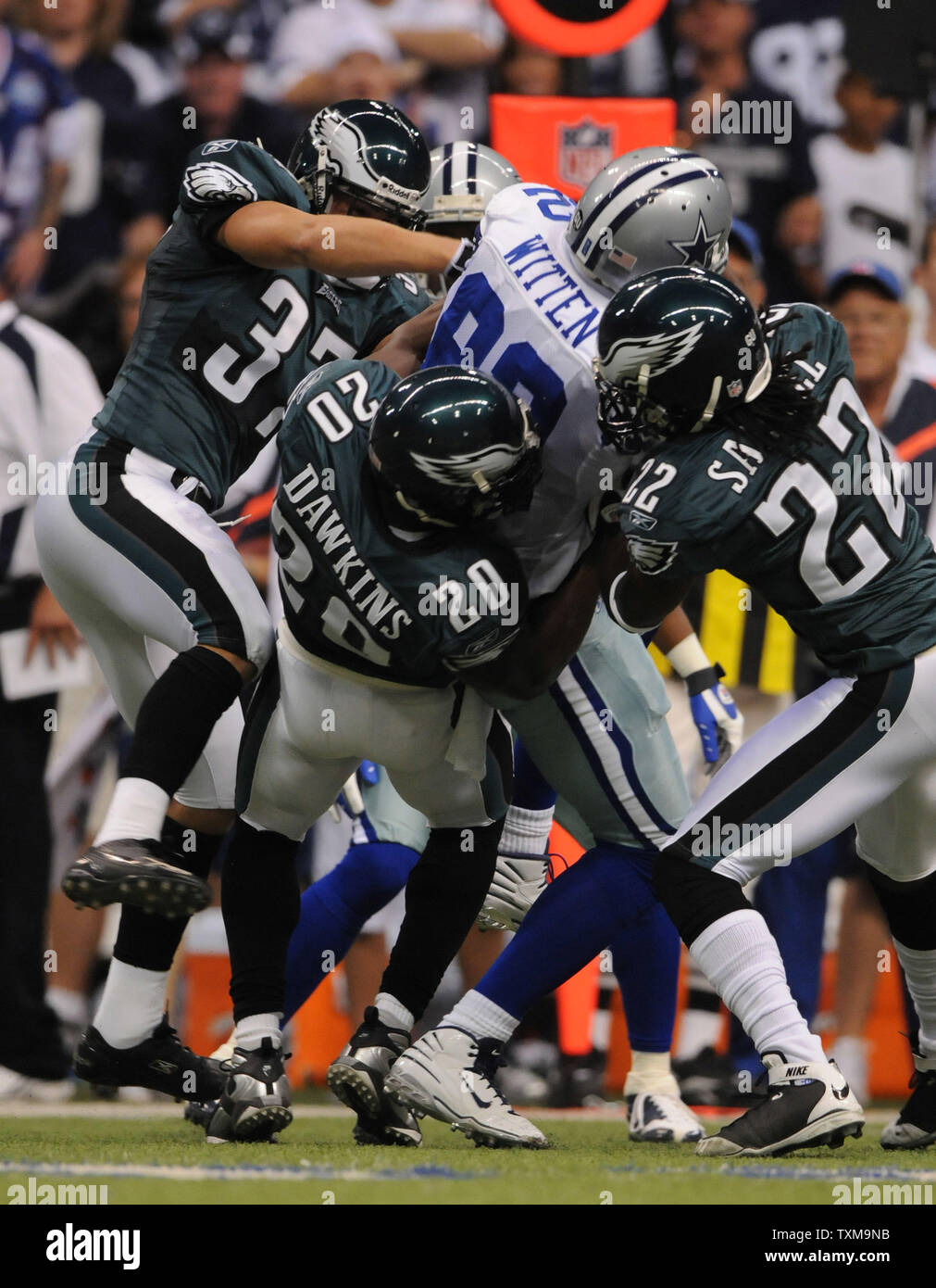 Dallas Cowboys wide reciever Jason Whitten gets wrapped up by Philadelphia Eagles Sean Considine (37), Brian Dawkins (20) and Asante Samuel (20) during the first half during the first half September 15, 2008 at Texas Stadium in Irving, Texas.  The Cowboys beat the Eagles 41-37.  (UPI Photo/Ian Halperin) Stock Photo