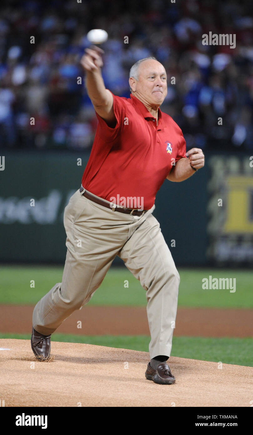 Texas Rangers team owner and MLB Hall of Famer Nolan Ryan throws the opening pitch in game one