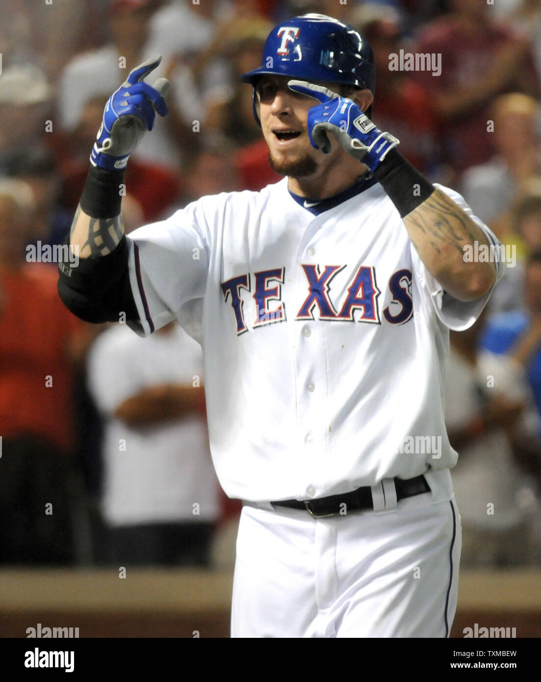 Texas Rangers Josh Hamilton gesters to the dugout after hitting a