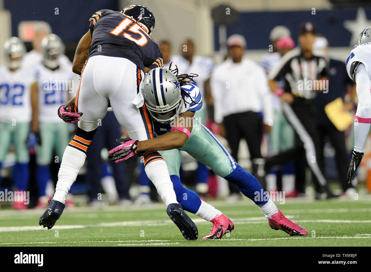 Chicago Bears receiver Brandon Marshall (15) is tackled by Dallas Cowboys  safety Danny McCray (40) after catching a short pass from Jay Cutler at  Cowboys Stadium in Arlington, Texas on October 1,