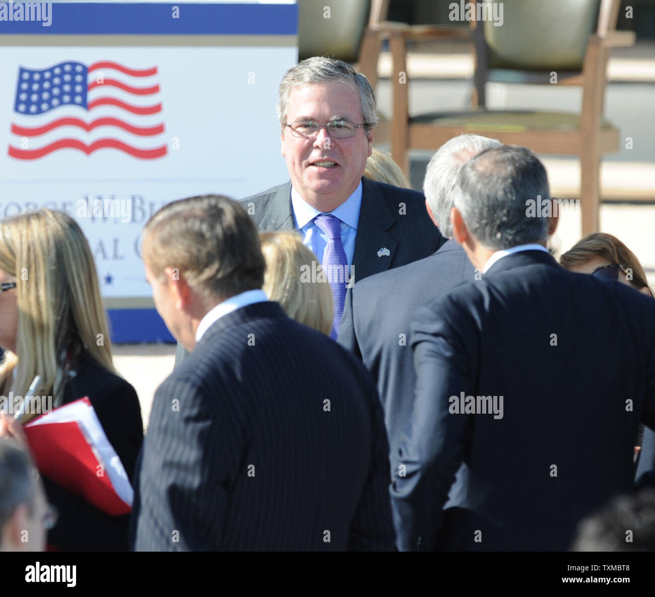 Jeb Bush makes his way to the dedication of the George W. Bush Presidential Library in Dallas on April 25, 2013. The museum, located on the campus of SMU in Dallas, features a permanent exhibit that uses artifacts, documents, photographs, and videos from the Library's extensive collection to capture the key decisions and events of the Presidency of George W. Bush.  UPI/Ian Halperin Stock Photo