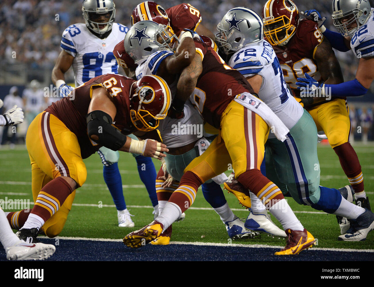Dallas Cowboys Joseph Randle runs for a 1-yard touchdown against the Washington Redskins in the fourth quarter at AT&T Stadium in Arlington, Texas on October 13, 2013. UPI/Kevin Dietsch Stock Photo