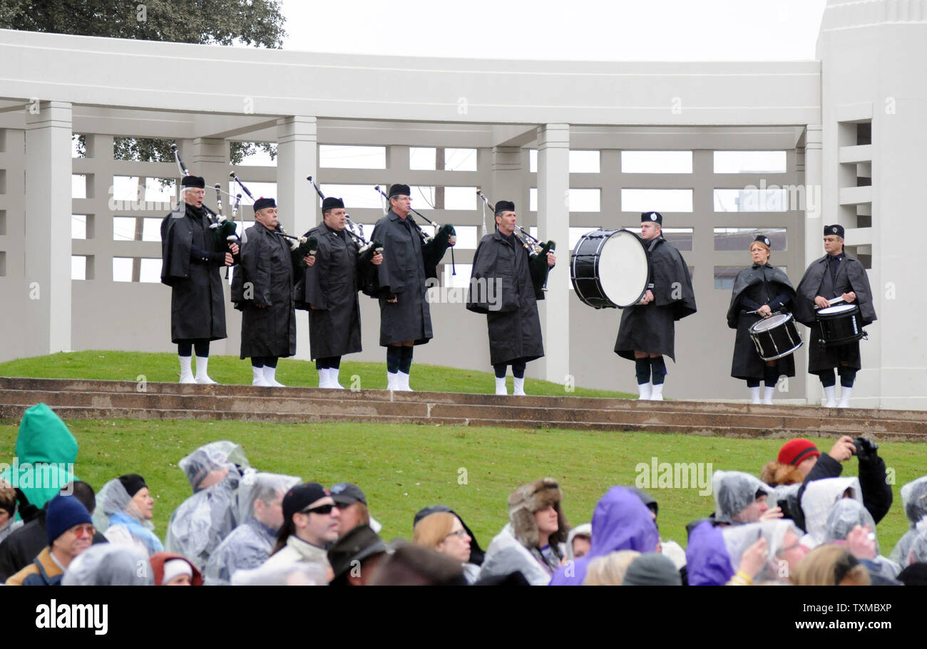 The Dallas Police Department Honorary Color Guard  plays at the opening of 'The 50th: Honoring the Memory of President John F. Kennedy' ceremony in Dealey Plaza on November 22, 2013 in Dallas, Texas.  The event honored the 50th anniversary of the assassination of President Kennedy on November 22, 1961.  Despite near freezing temperatures and rain, thousands of JFK fans, history buffs, conspiracy theorists and media members attended the event.  UPI/Ian Halperin Stock Photo