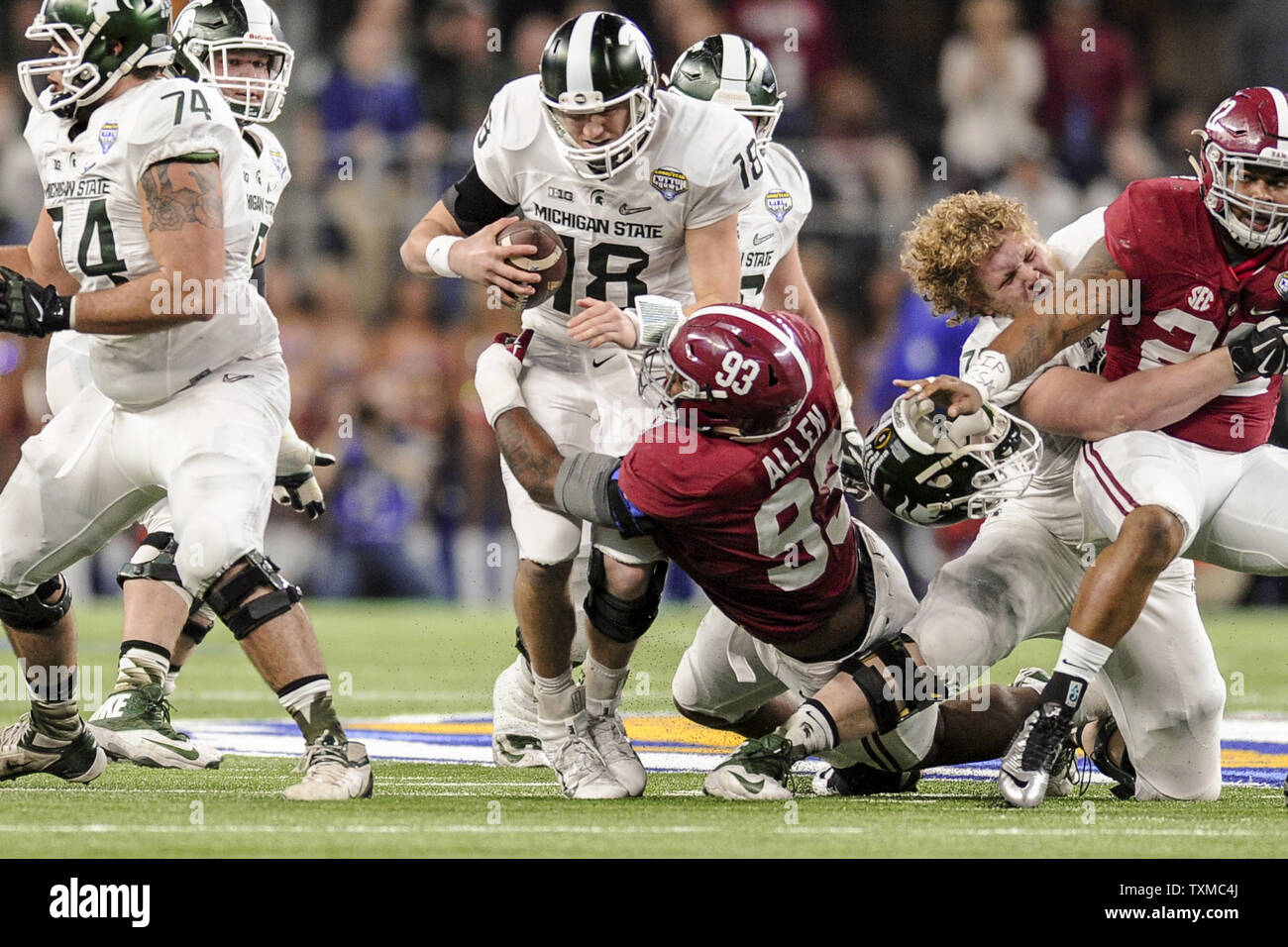 Alabama defensive lineman Jonathan Allen (93) sacks Michigan State quarterback Connor Cook (18) during the second quarter of the College Football Playoff Semifinal at the Goodyear Cotton Bowl Classic at AT&T Stadium on December 31, 2015 in Arlington, Texas. Photo by Michael Prengler/UPI Stock Photo