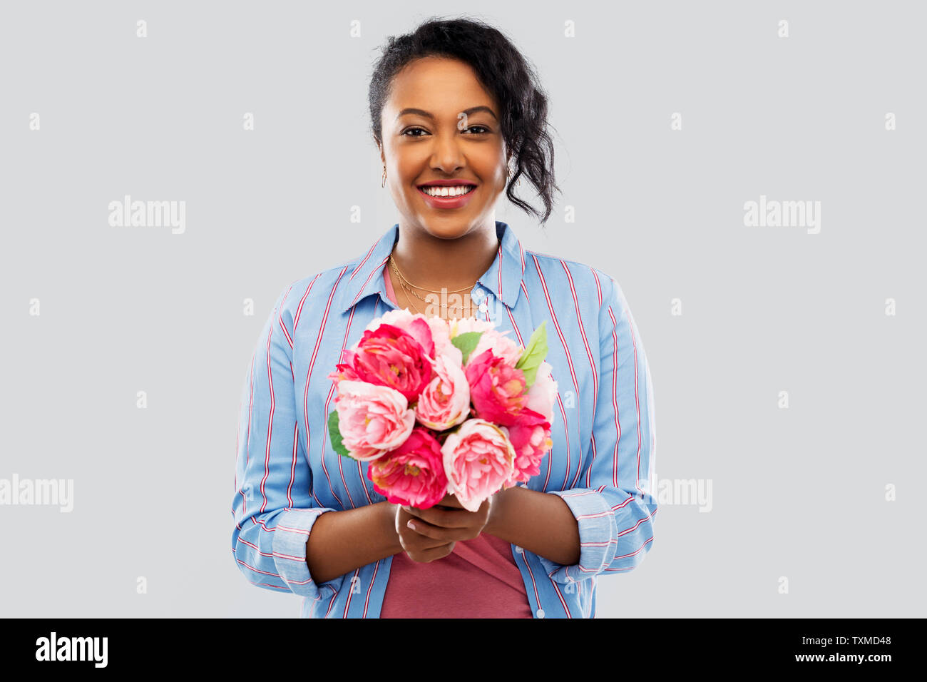happy african american woman with bunch of flowers Stock Photo - Alamy
