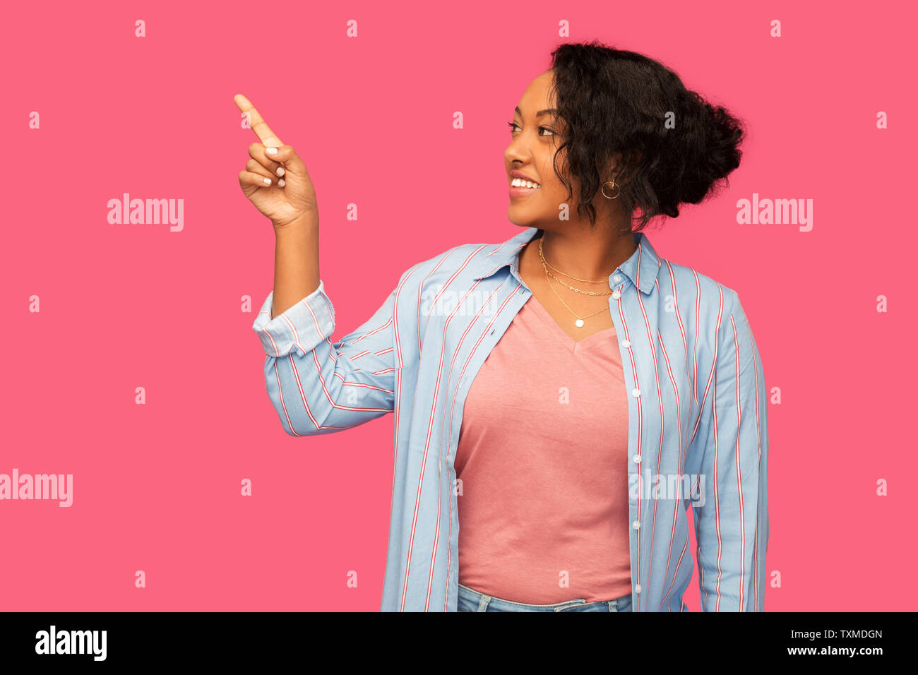 happy african american woman pointing finger up Stock Photo - Alamy