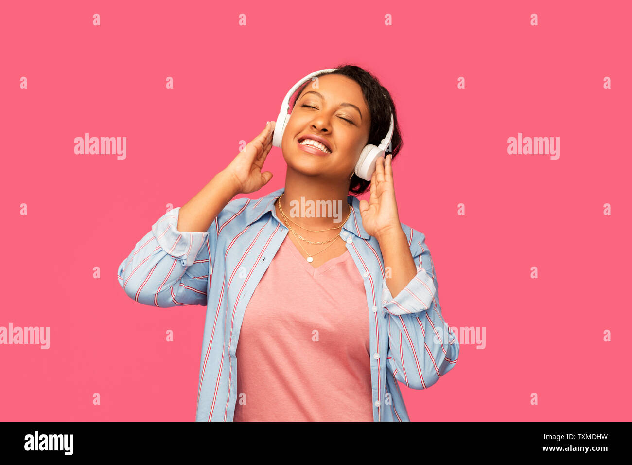 african woman in headphones listening to music Stock Photo - Alamy