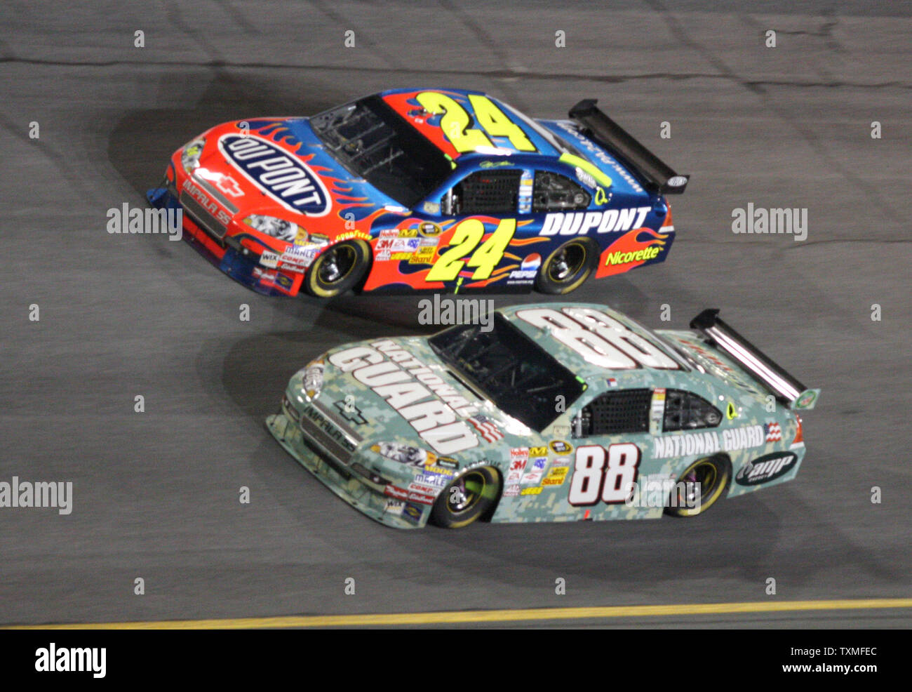 Dale Earnhardt Jr. (88) passes teammate Jeff Gordon in turn four