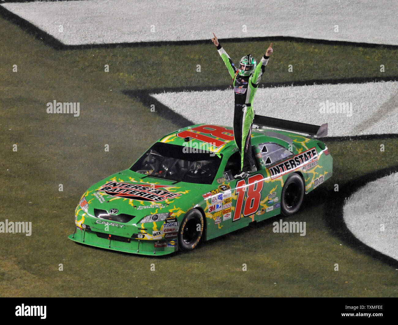 Kyle Busch celebrates winning the NASCAR Sprint Cup Coke Zero 400 at