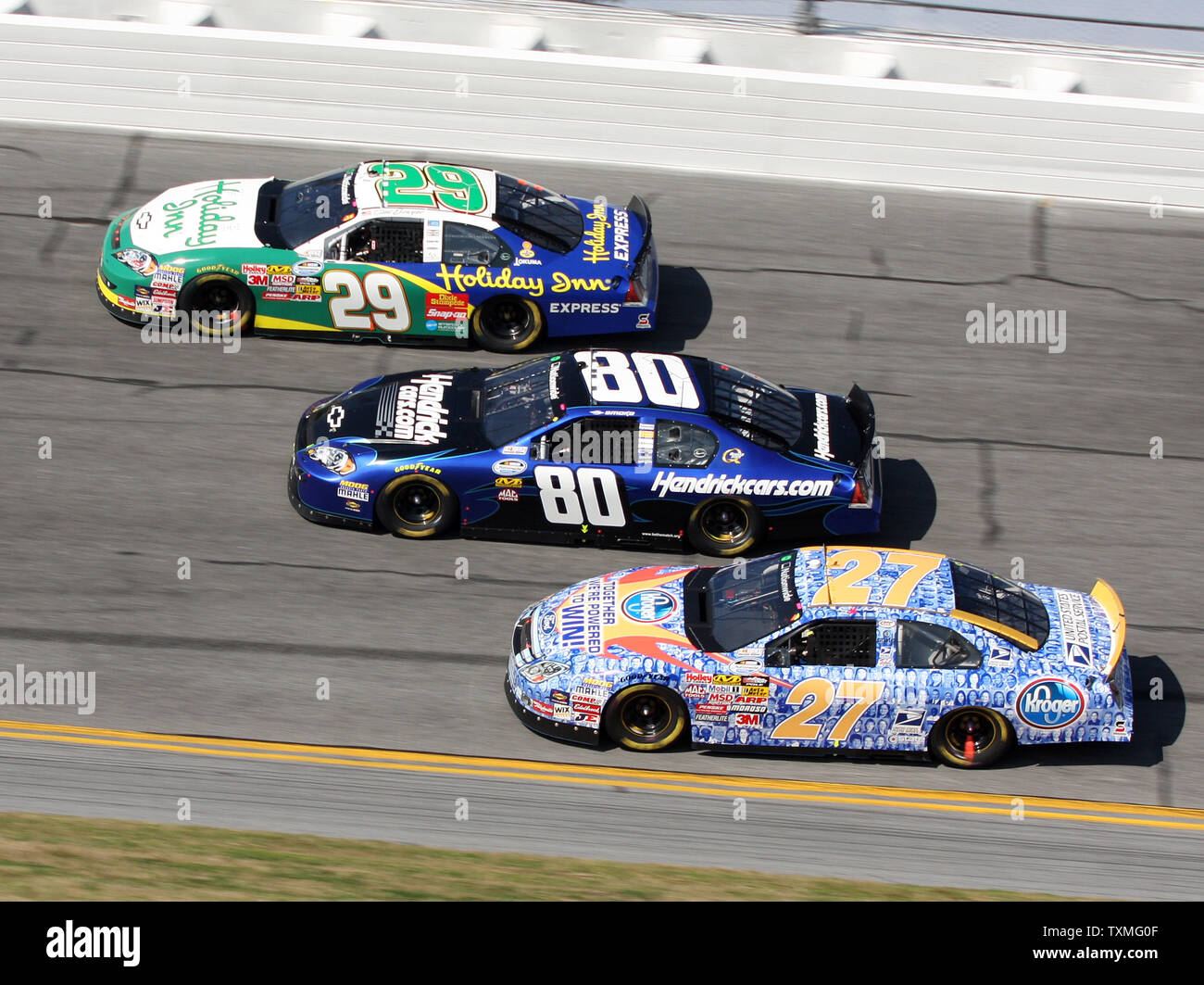 Clint Bowyer (29), Tony Stewart (80) and Jason Keller (27) go three wide in turn three during the NASCAR Nationwide series Camping World 300 at Daytona International Speedway in Daytona Beach, Florida on February 14, 2009. Stewart went on to win the race. (UPI Photo/Malcolm Hope) Stock Photo