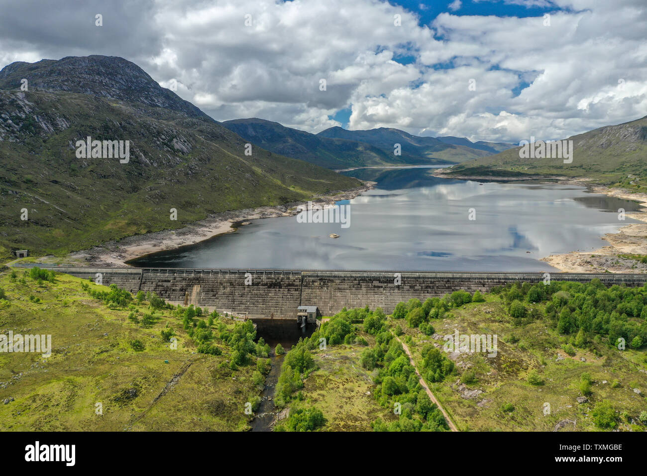 An aerial view looking towards Loch Cluanie dam and the countryside surrounding the loch, Scottish Highlands Stock Photo