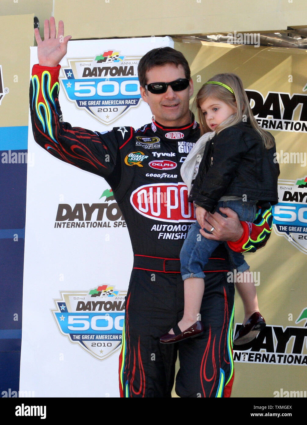 Jeff Gordon and his daughter Ella Sofia wave to the crowd during driver introductions prior to the start of the Daytona 500 at Daytona International Speedway in Daytona Beach, Florida on February 14, 2010. UPI Photo/Malcolm Hope Stock Photo