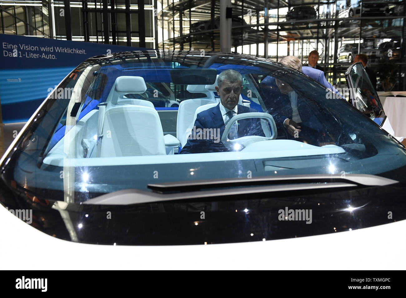 Drazdany, Germany. 25th June, 2019. Czech Prime Minister Andrej Babis, center, visits a Volkswagen plant in Dresden, Germany, on June 25, 2019. On the photo is seen a Showcard ID concept and Director of the plant Lars Dittert, right. Credit: Ondrej Deml/CTK Photo/Alamy Live News Stock Photo
