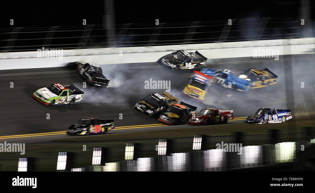 Tim George, Jr. (5) pulls away as Jason White (93), Ryan Truiex (30), Clay Greenfield (68), John Wes towny (7) and Max Gresham (8) crash in lap 53 of the NASCAR Camping World Truck Series NextEra Energy Resources 250 truck race at Daytona International Speedway in Daytona Beach, Florida February 22, 2013. UPI/Marc Serota Stock Photo