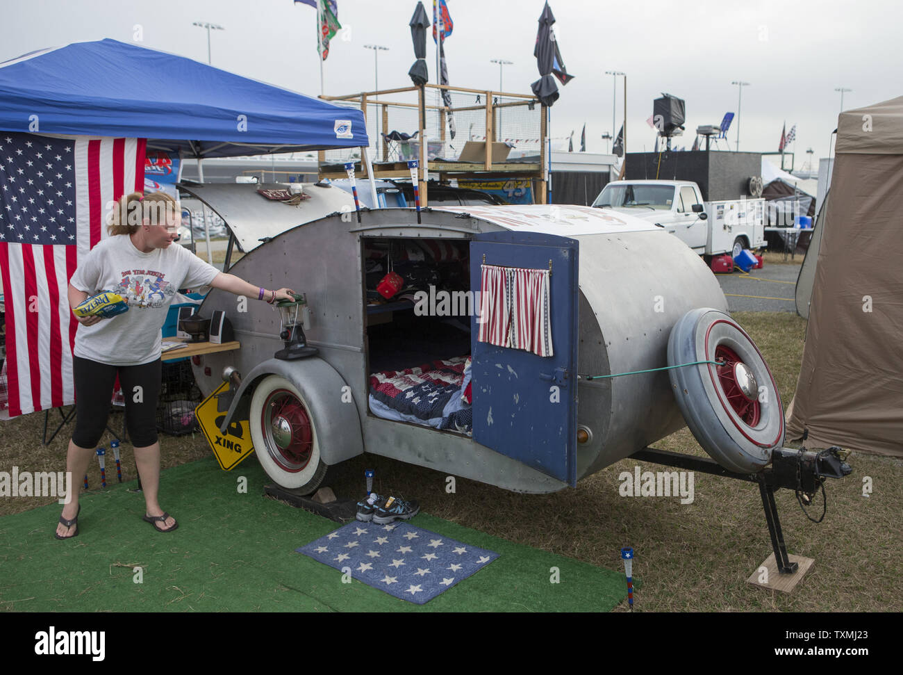 Stacey Earnst, from Louisiana, spends her 10th wedding anniversary camping with her husband in their 1948 teardrop camper on the infield waiting for the start of the NASCAR Sprint Cup Series Daytona 500 auto race at Daytona International Speedway in Daytona Beach, Florida February 24, 2013.  UPI/Dave Ferrell Stock Photo