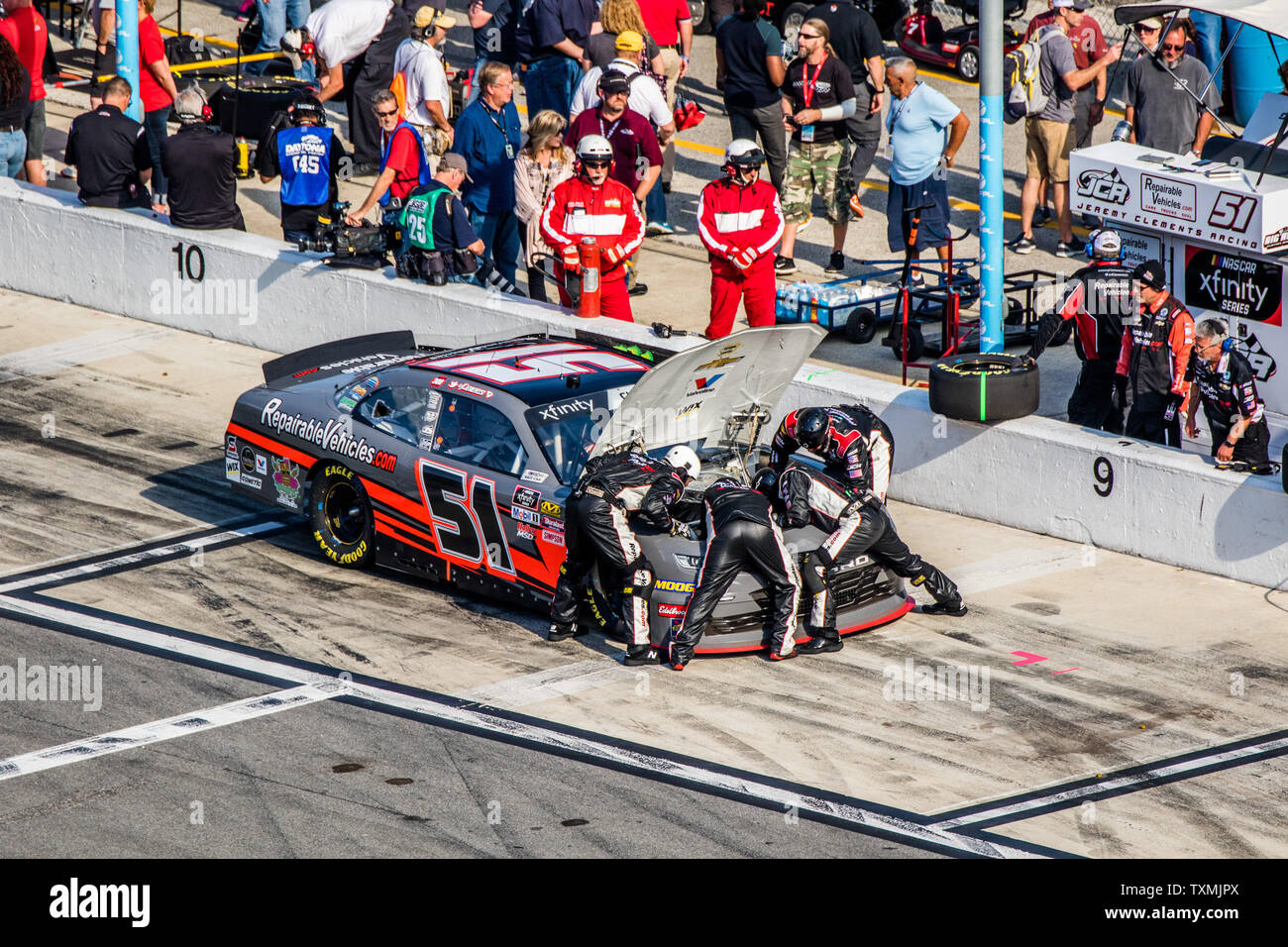 Jeremy Clements crew works furiously on an engine issue which eventually sidelined him from the 2019 NASCAR Racing Experience 300 on February 16, 2019 in Daytona, Florida. Photo by Edwin Locke/UPI Stock Photo