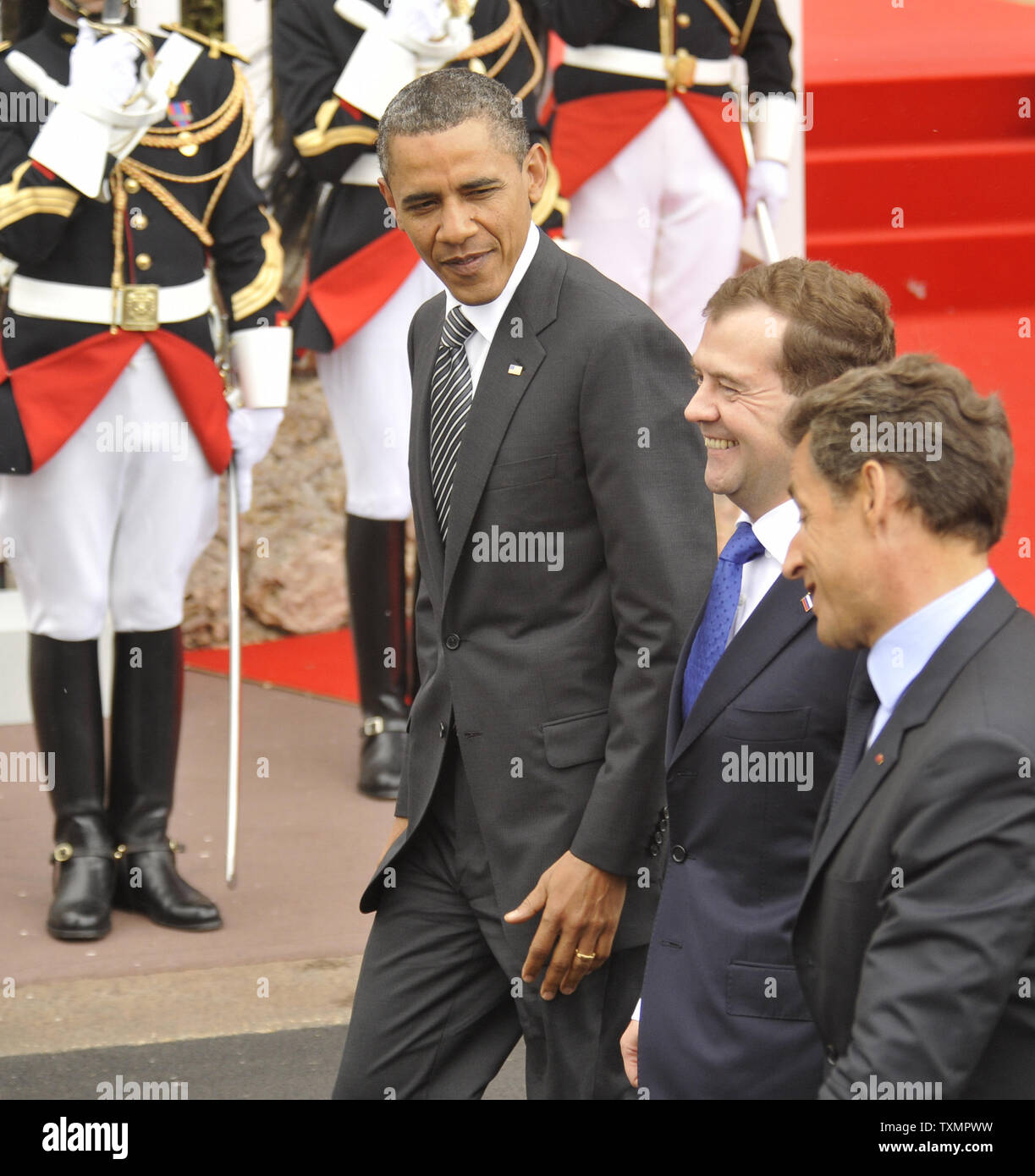 U.S. President Barack Obama (L), Russian President Dmitry Medvedev and French President Nicolas Sarkozy (R) walk together as they arrive at the G8 Summit in Deauville, France, May 26, 2011.    UPI Stock Photo