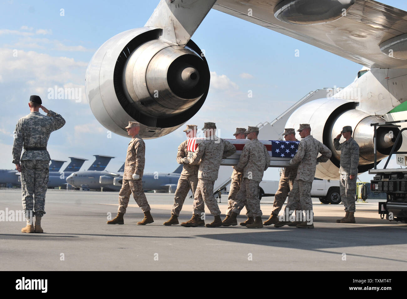 An Marine Transfer Unit moves the transfer cases containing the remains ...