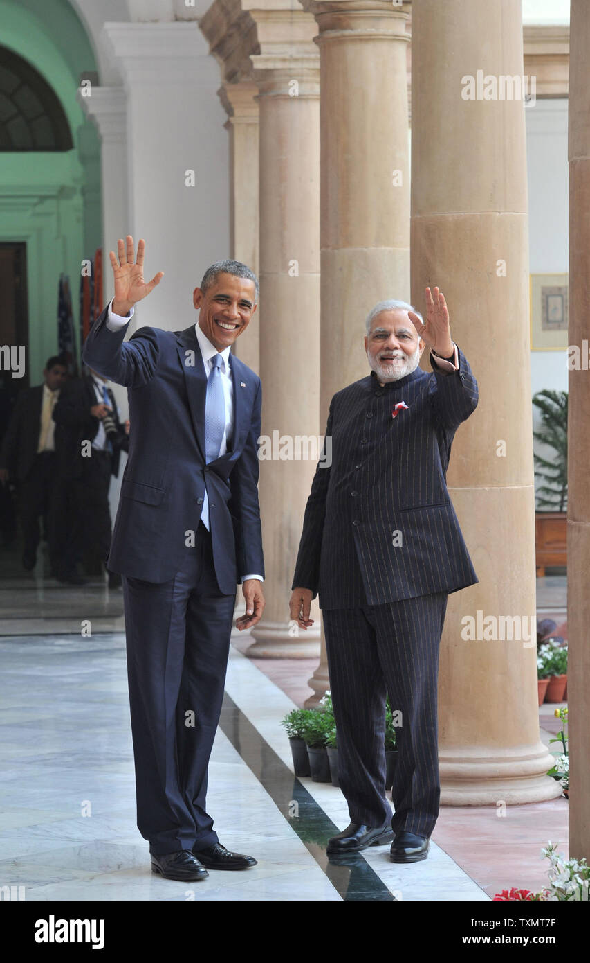 Prime Minister Shri Narendra Modi (R) waves with US President  Barack Obama at Hyderabad House in New Delhi, India on January 25, 2015. President Obama is on a three day visit and will be the guest of honor at at India's Republic Day celebrations.    UPI Stock Photo