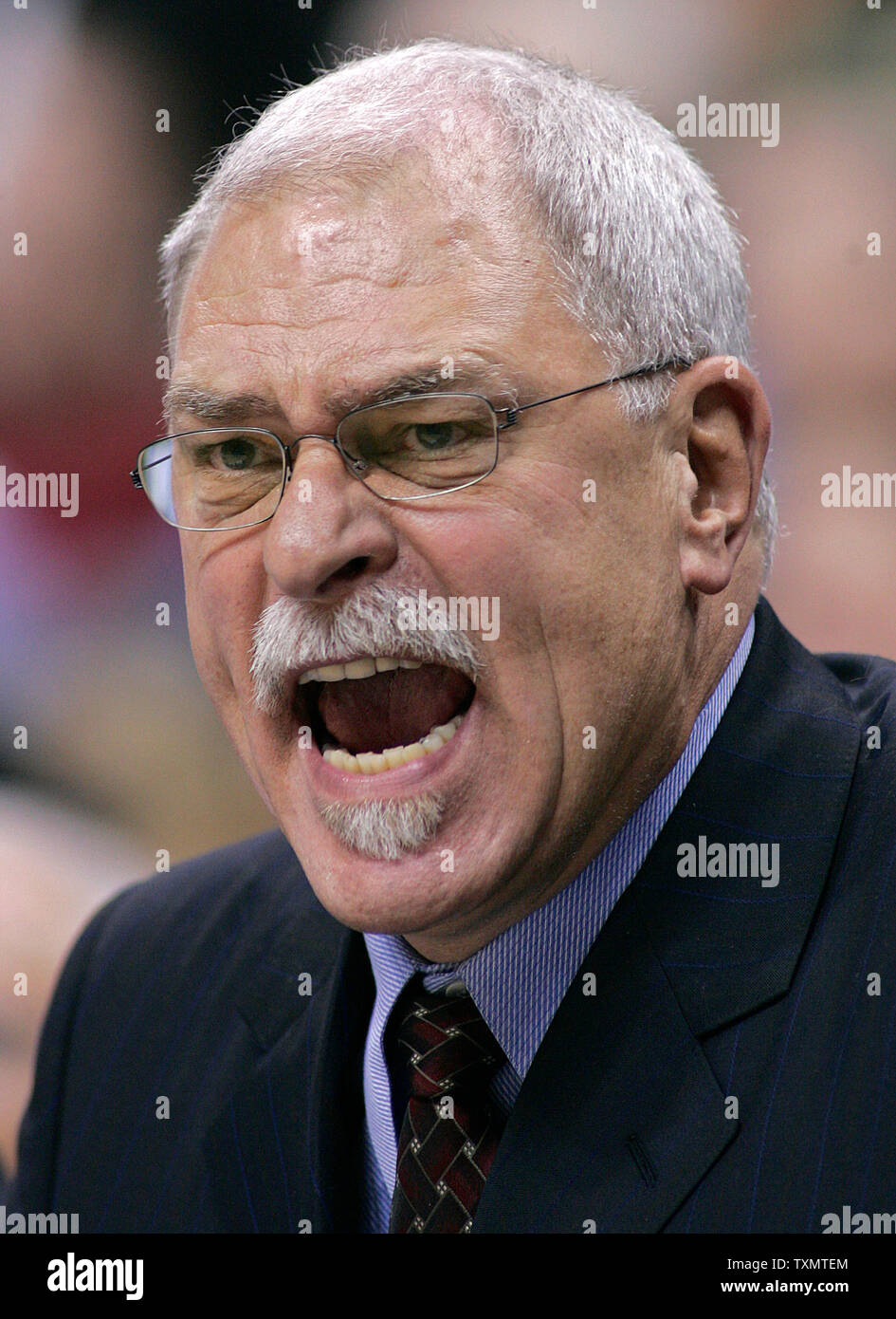 Los Angeles Lakers head coach Phil Jackson shouts at his team during second quarter against the Denver Nuggets in the Lakers season opener at the Pepsi Center in Denver November 2, 2005.   Jackson is making his return to the Lakers and Kobe Bryant after a year's absence.    (UPI Photo/Gary C. Caskey) Stock Photo