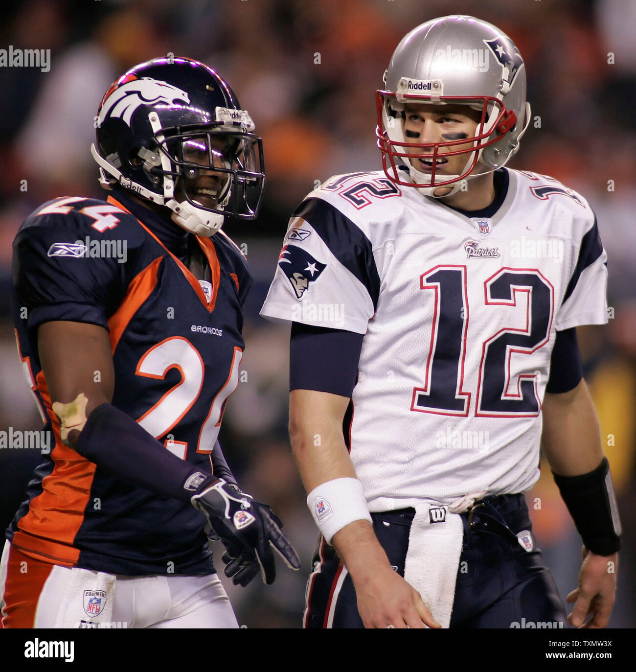 Denver Broncos defensive back Champ Bailey (L) talks with New England Patriots quarterback during the AFC divisional playoff game at Invesco Field in Denver onJanuary 14, 2006.  Denver beat New England 27-13. (UPI Photo/Gary C. Caskey) Stock Photo