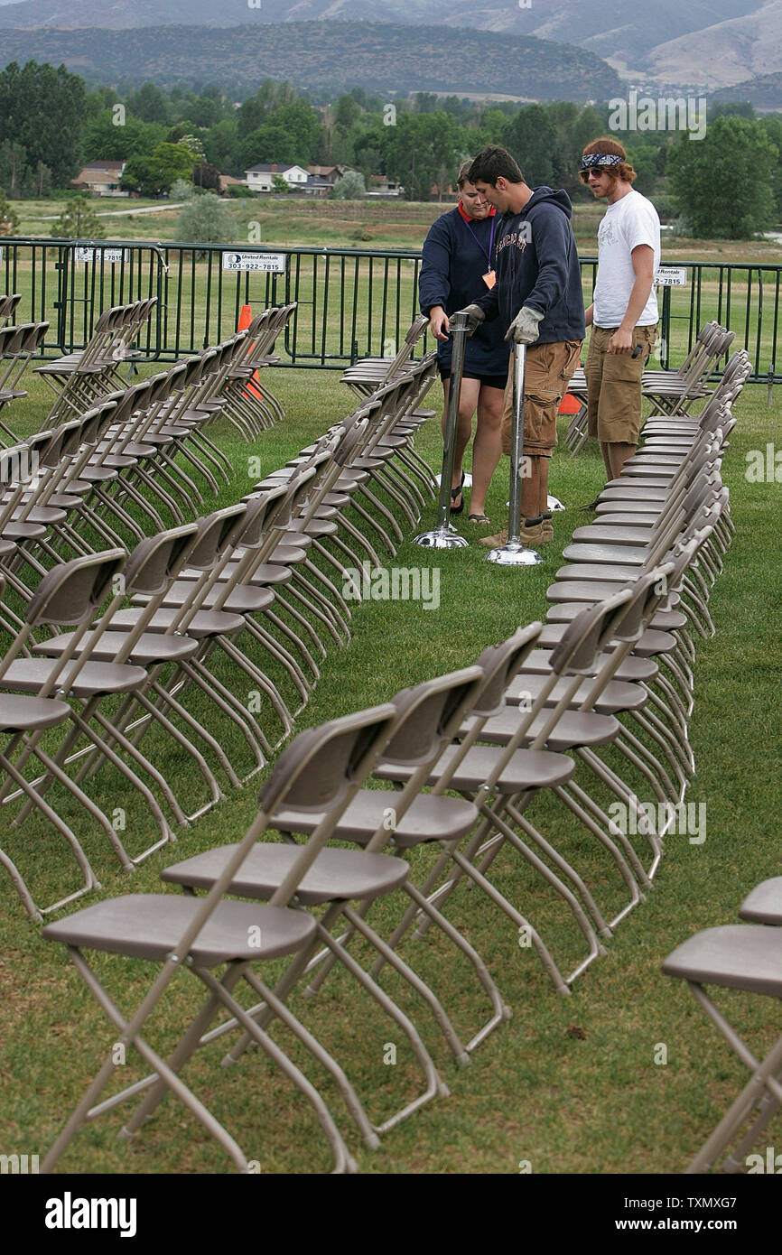 Workers place ropes to seperate Columbine victims family members and the public prior to the start of the official Columbine memorial groundbreaking ceremony at Clement Park in Littleton, Colorado June 16, 2006.  Former President Bill Clinton spoke at the groundbreaking ceremony to help raise the remaining money for the $1.5 million dollar memorial.  The Columbine memorial will be at the base of Rebel hill near Columbine high school where on April 20, 1999, Dylan Klebold and Eric Harris terrorized the school killing one teacher and twelve students before taking their own lives.   (UPI Photo/Ga Stock Photo