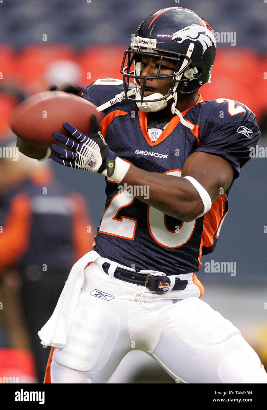 Denver Broncos running back Mike Anderson (L) is tackled by Philadelphia  Eagles linebacker Jeremiah Trotter (R) at Invesco Field at Mile High Staium  in Denver on October 30, 2005. (UPI Photo/Gary C.