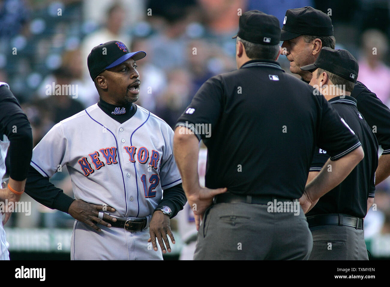 New York Mets manager Willie Randolph (L) talks to umpires (L-R) Bill Welke, Tim McClelland, and Marty Foster prior to the start of the game against the Colorado Rockies at Coors Field in Denver August 29, 2006.  (UPI Photos/Gary C. Caskey) Stock Photo
