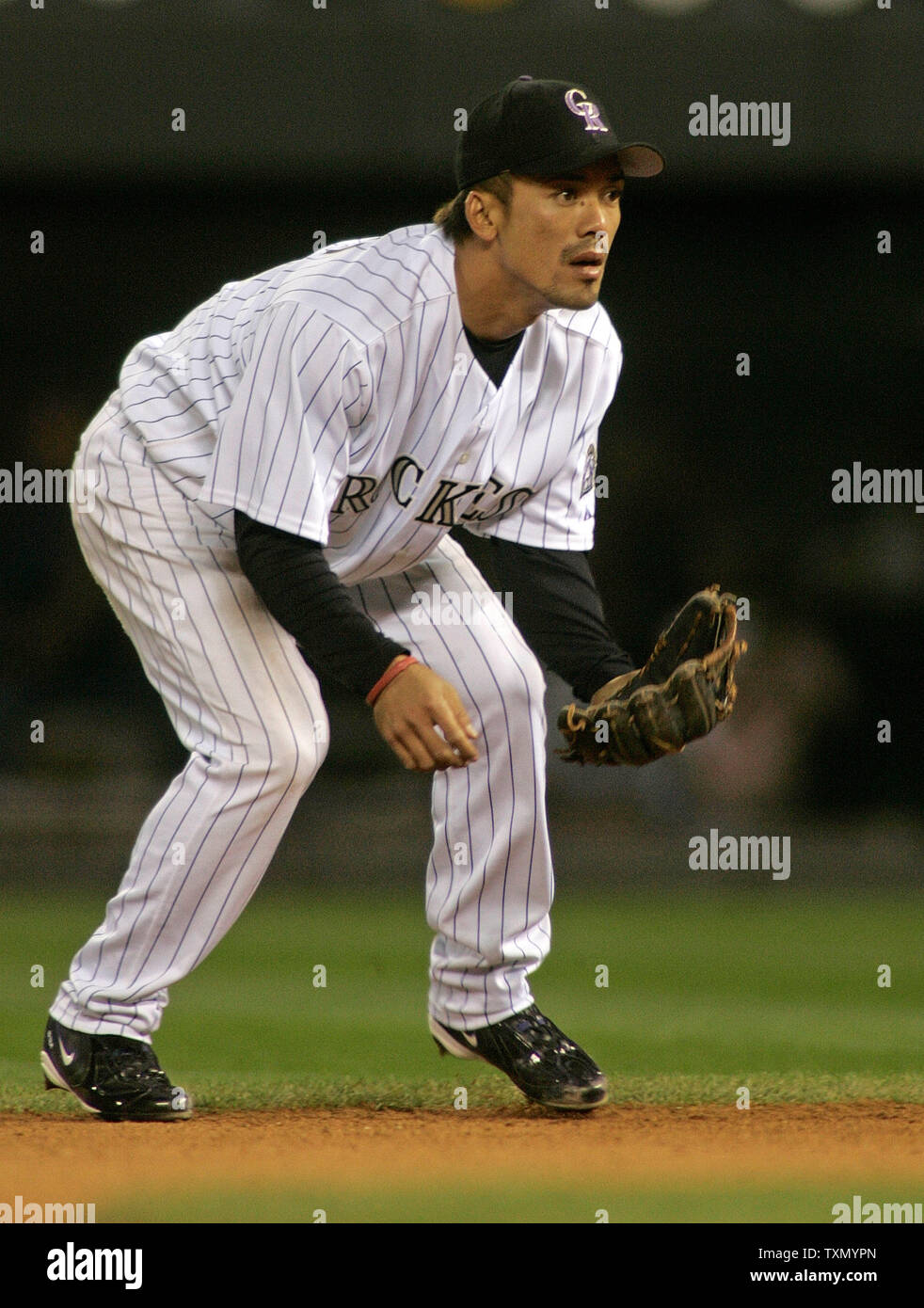 Colorado Rockies infielder Vinny Castilla in his third stint with the  Rockies is officially recognized in the fifth inning against the Los  Angeles Dodgers at Coors Field in Denver September 28, 2006.