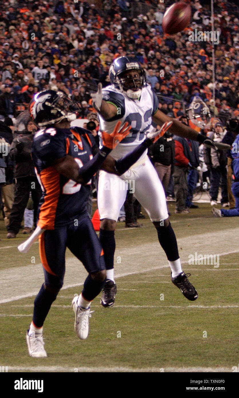 Denver Broncos cornerback Champ Bailey (l) intercepts a pass intended for Seattle Seahawks Darrell Jackson (R) in the third quarter at Invesco Field at Mile High in Denver December 3, 2006.  Seattle beat Denver 23-20.  (UPI Photo/Gary C. Caskey) Stock Photo